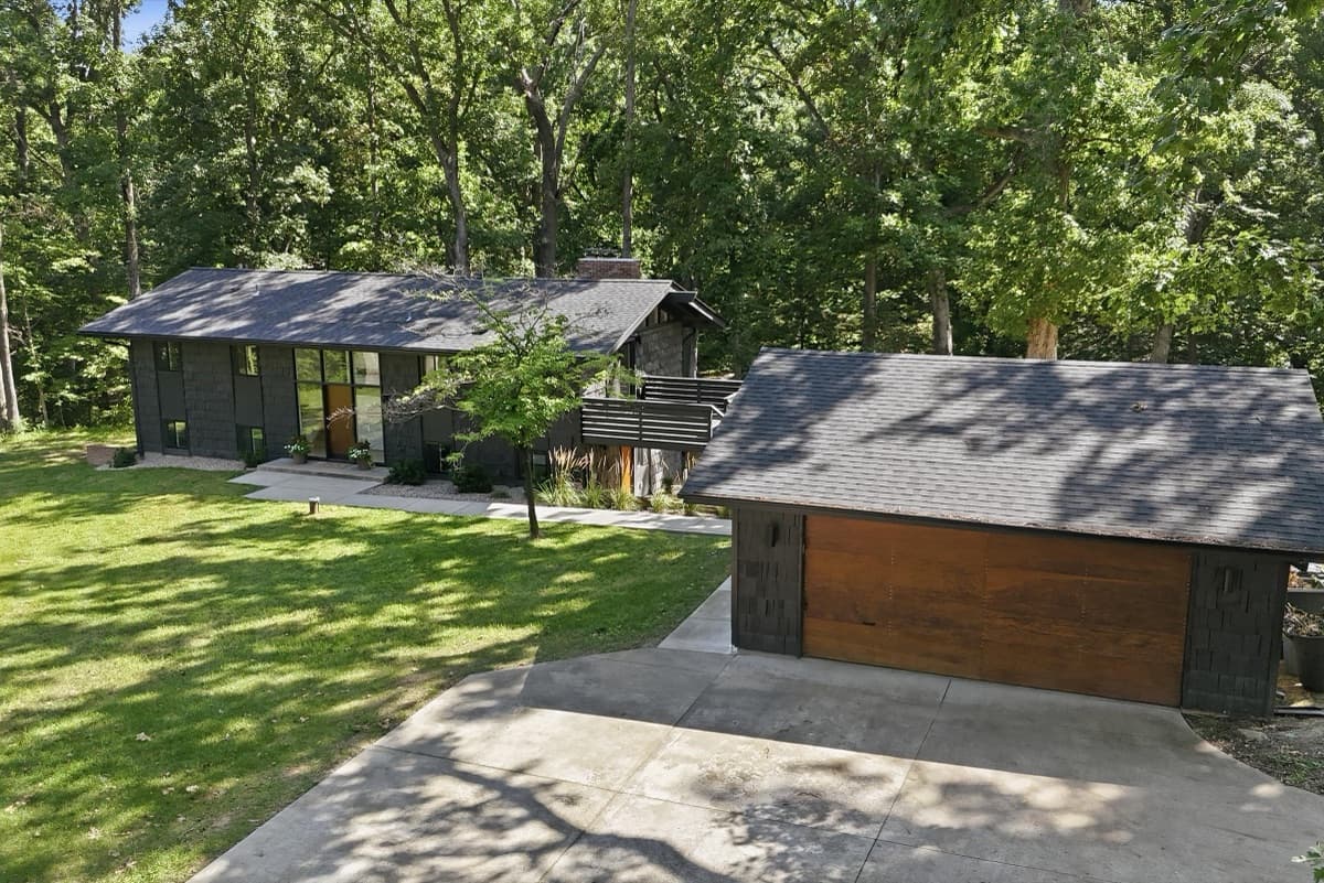 Aerial view of the home, driveway and detached garage