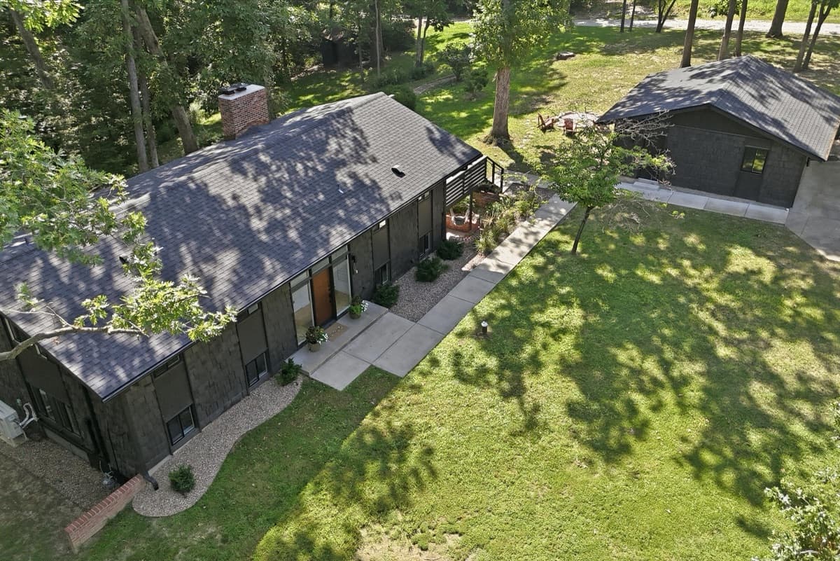 Aerial view of the house, deck and detached garage